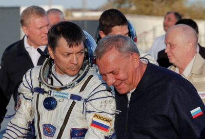 The chief of Russia's space agency Roscosmos, Yuri Borisov, accompanies cosmonaut Oleg Kononenko as he gets ready to board the Soyuz MS-24 spacecraft at the Baikonur cosmodrome, in Kazakhstan, in September.  
