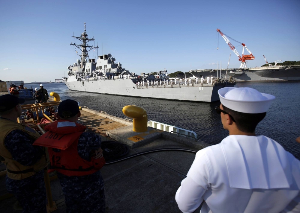 The U.S. guided-missile destroyer USS Milius arrives at the American naval base in Yokosuka, Japan, in May 2018. 