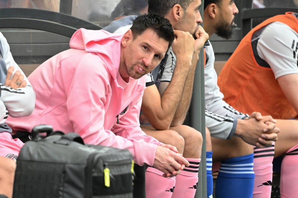 Lionel Messi sits on the bench during Inter Milan's friendly against Hong Kong XI in Hong Kong on Sunday.