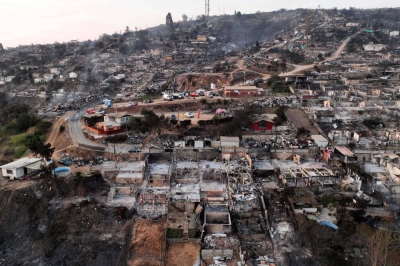 The aftermath of a wildfire in Villa Independencia, Valparaiso region, Chile on Sunday.
