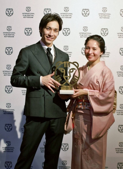 Director Toshihiko Tanaka (left) is pictured in Rotterdam, the Netherlands, on Feb. 2, after his film, "Rei," won the top Tiger Award at the International Film Festival Rotterdam.