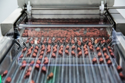 Pills move through a sorting machine at a pharmaceutical plant in Visakhapatnam, India. A recent report shows one Indian firm using suppliers with ties to China’s military industry, questionable track records on safety and bases in Xinjiang.