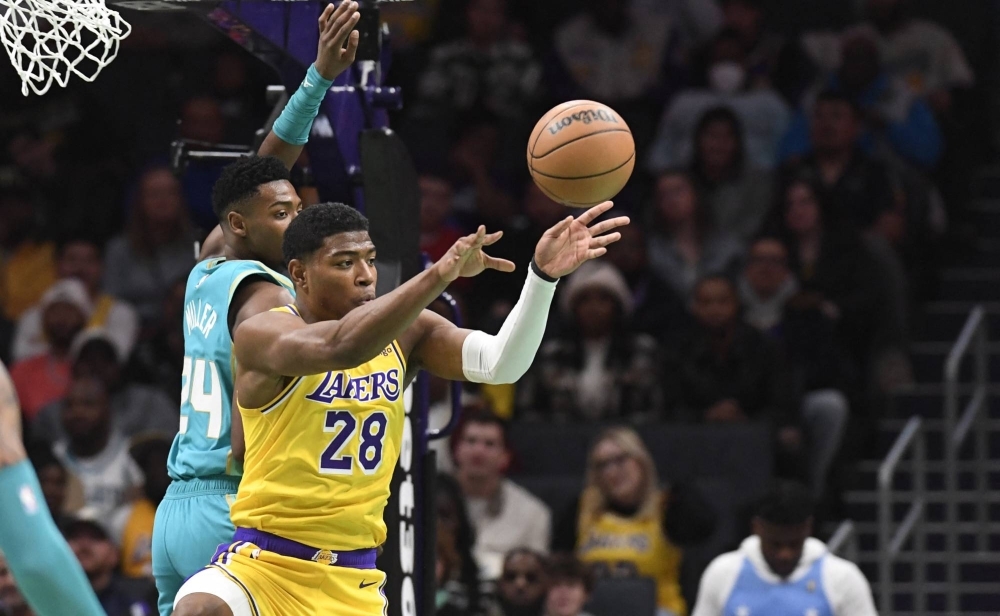 Los Angeles Lakers forward Rui Hachimura passes during the first half against the Charlotte Hornets at the Spectrum Center in Charlotte, North Carolina, on Monday.