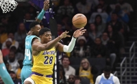 Los Angeles Lakers forward Rui Hachimura passes during the first half against the Charlotte Hornets at the Spectrum Center in Charlotte, North Carolina, on Monday. | USA TODAY / via Reuters