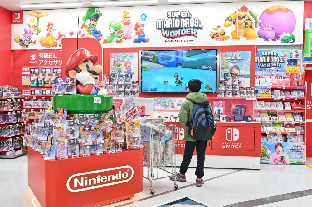 Nintendo has raised its forecast for Switch console sales and its overall operating profit for the year ending in March.