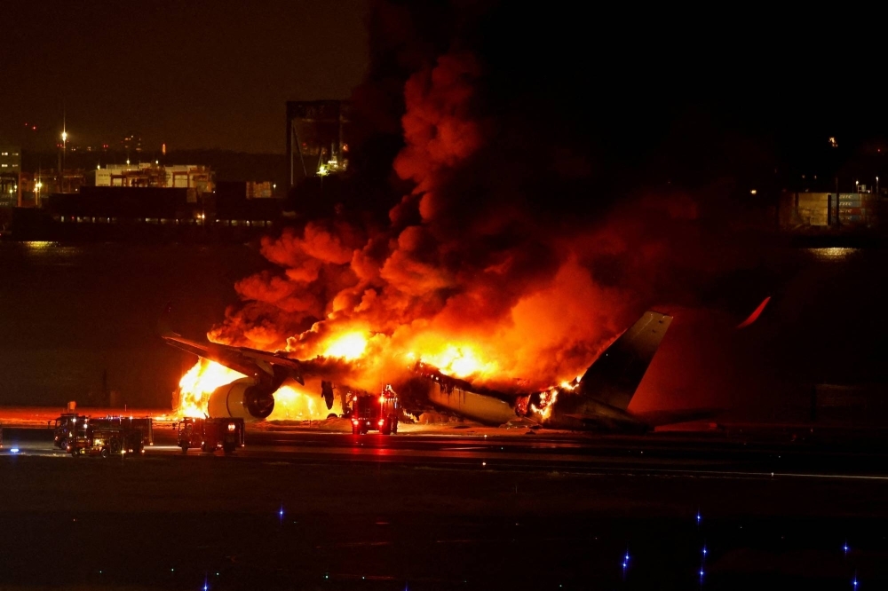 A Japan Airlines jet is on fire at Haneda Airport in Tokyo on Jan. 2.