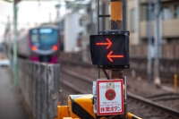 A railway crossing in Japan. A railway crossing gate in Osaka city opened before a train passed through on Tuesday, scraping a car that had proceeded to cross. | Getty Images