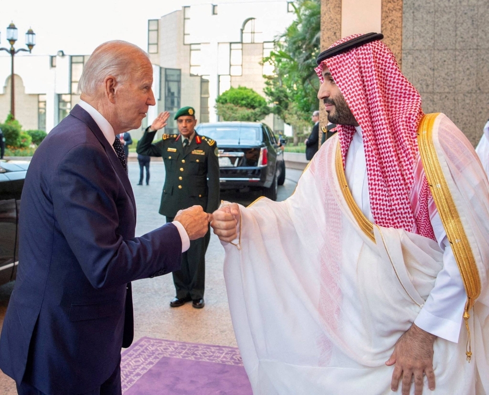 Saudi Crown Prince Mohammed bin Salman (right) fist bumps U.S. President Joe Biden upon his arrival at Al Salman Palace, in Jeddah, Saudi Arabia, on July 15, 2022.