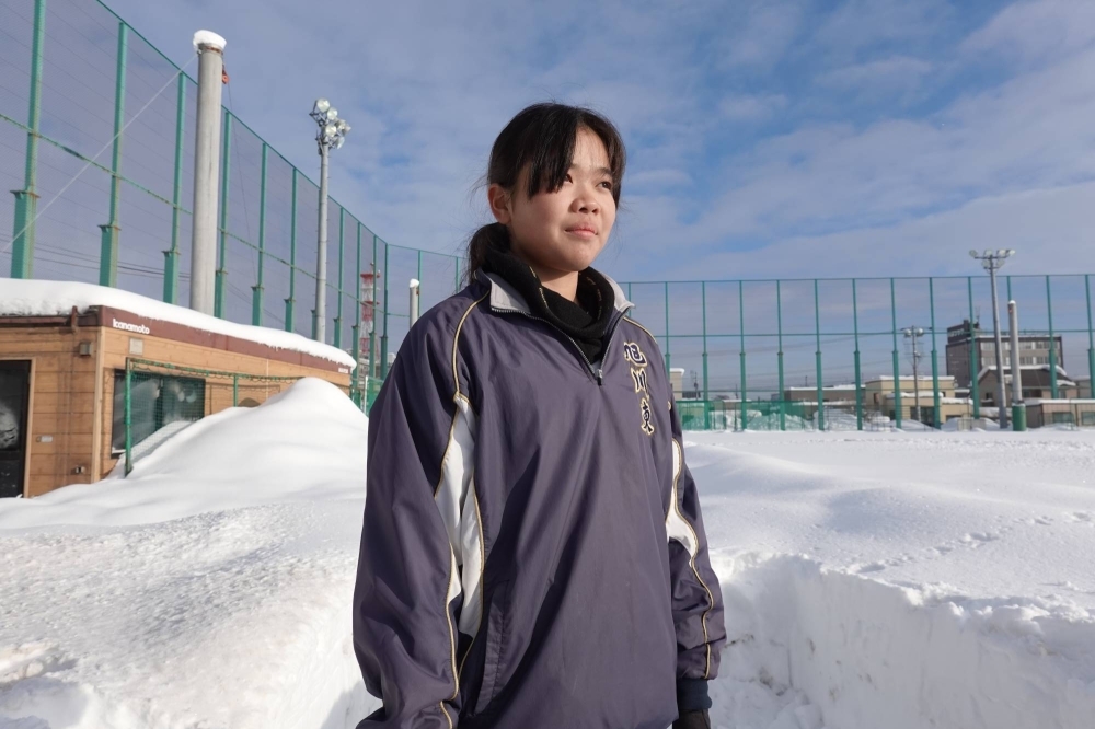 Shiki Nakayama at a snow-covered baseball field in Asahikawa, Hokkaido, last month. Nakayama grew up watching her older brother’s exploits on the diamond and first picked up a bat and ball in elementary school.