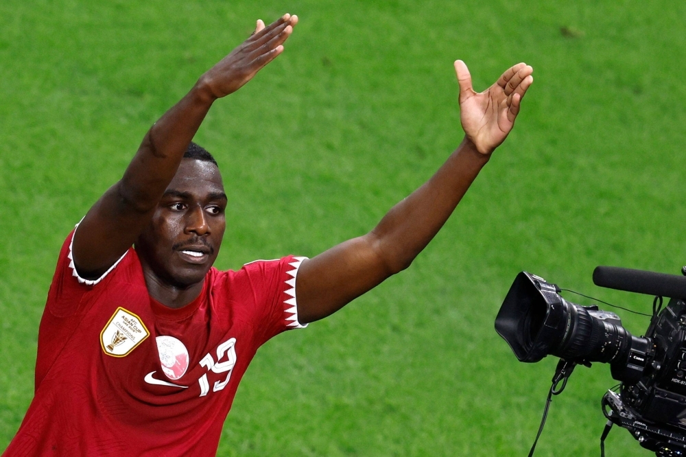 Qatar forward Almoez Ali scores his team's third goal during against Iran in the semifinals of the Asian Cup on Wednesday.  