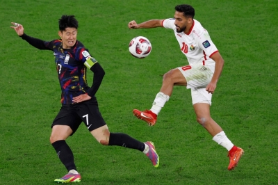 Jordan midfielder Mousa Al-Tamari (right) and South Korea's Son Heung-min vie for the ball during their Asian Cup semifinal match in Al-Rayyan, Qatar, on Tuesday.