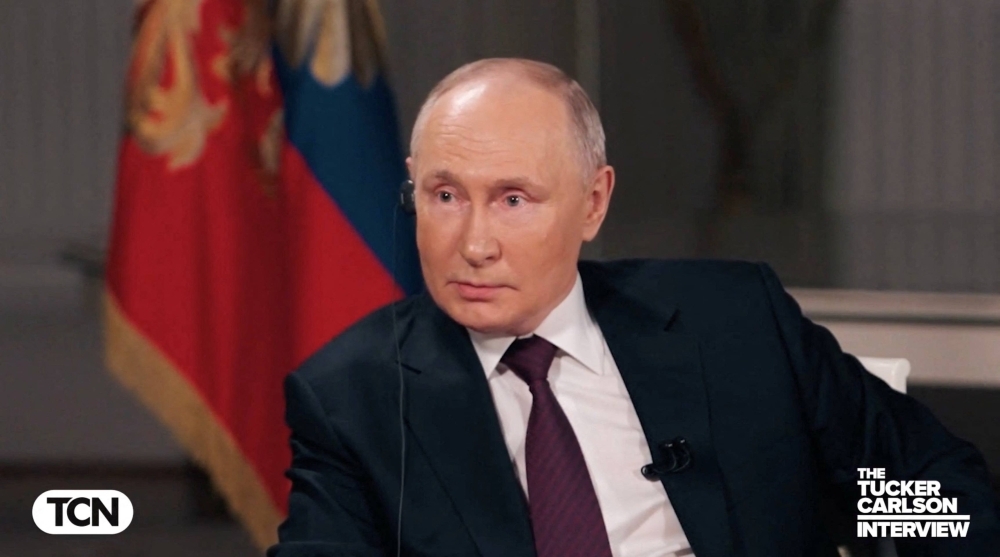 Russian President Vladimir Putin speaks during an interview with U.S. television host Tucker Carlson in Moscow on Tuesday. This is the first time the Russian leader has given an interview to a Western media figure since he ordered the February 2022 invasion of Ukraine.