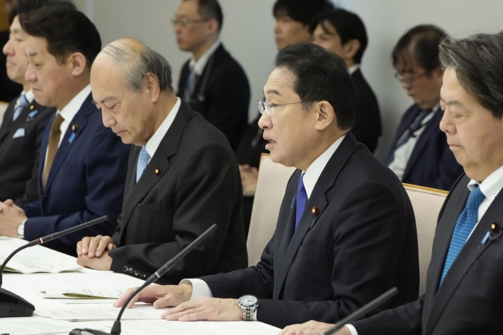 Prime Minister Fumio Kishida discusses a new foreign worker system, in Tokyo on Friday.