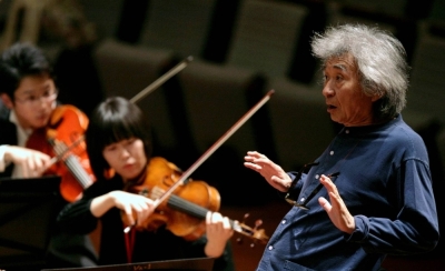 Maestro Seiji Ozawa conducts the Seiji Ozawa Ongaku-juku orchestra during a rehearsal in Beijing in 2009. 