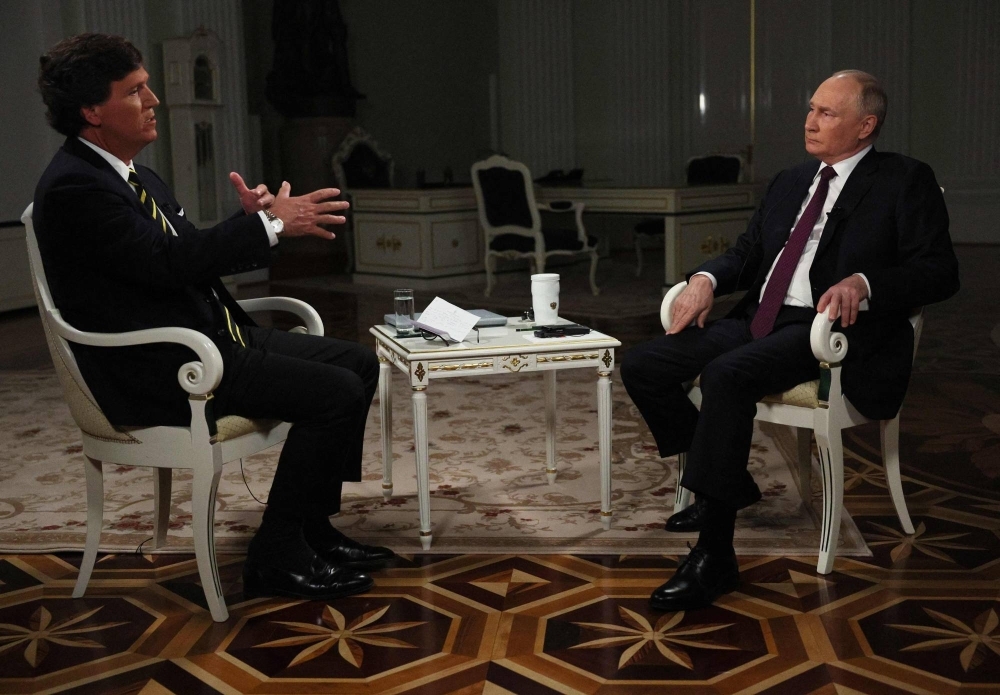 Russian President Vladimir Putin gives an interview to U.S. talk show host Tucker Carlson at the Kremlin in Moscow on Tuesday. 