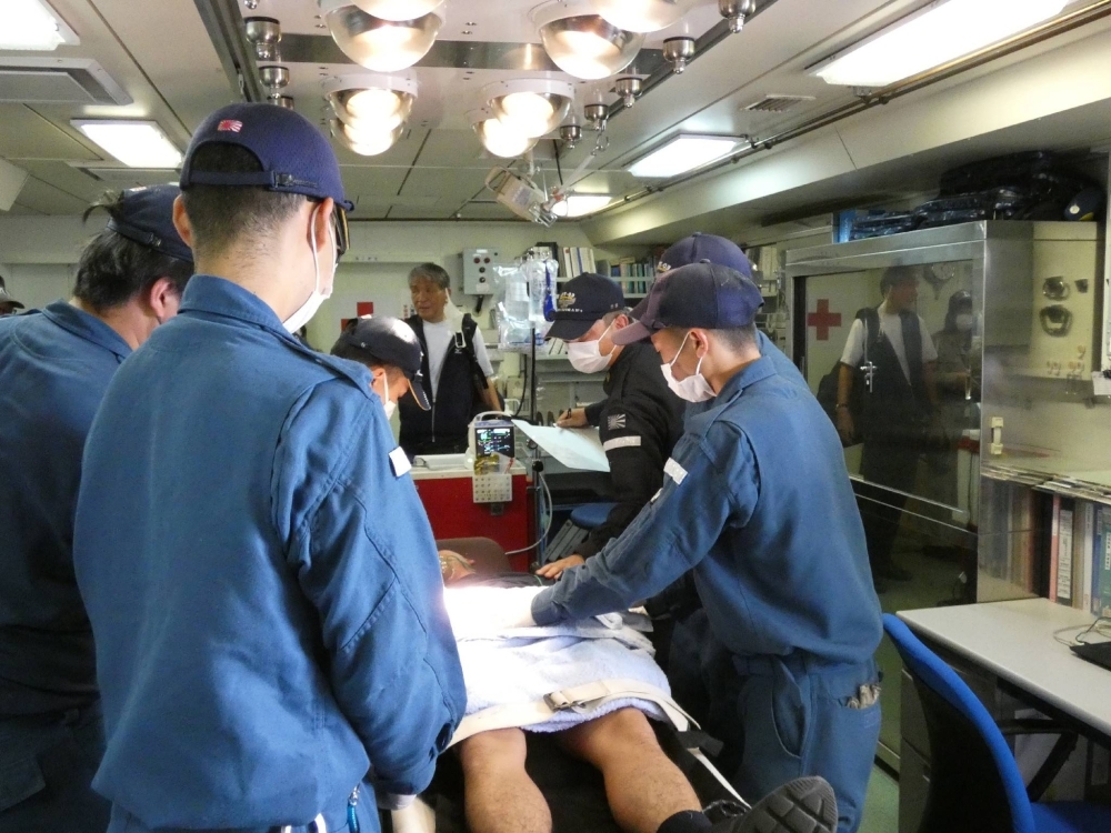 Maritime Self-Defense Force officers engage in a training of emergency medical treatment in the Kunisaki transport vessel in September 2022. 