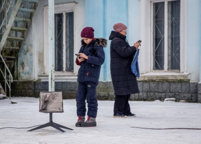 Local residents use a Starlink terminal in Chasiv Yar, Donetsk region, Ukraine, on Jan. 31, 2023. 