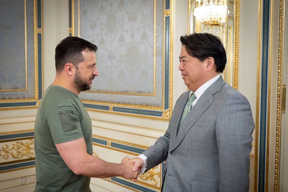 Ukraine's President Volodymyr Zelenskyy shakes hands with then-Foreign Minister Yoshimasa Hayashi prior to their meeting in Kyiv in September.