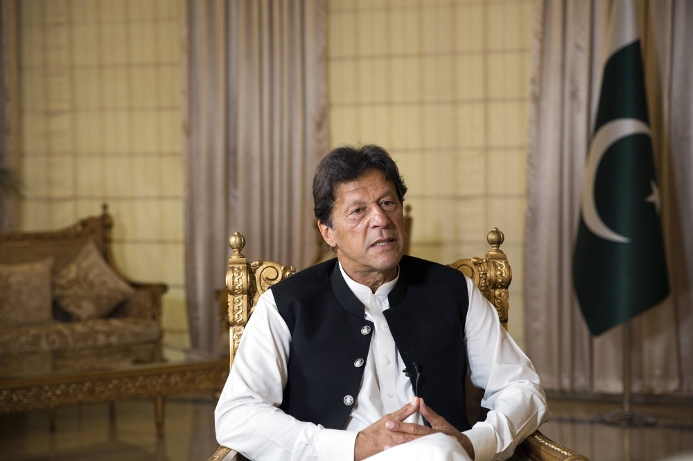 Former Prime Minister of Pakistan Imran Khan, who is currently imprisoned, speaks with foreign journalists at his residence in Islamabad on April 9, 2019. 