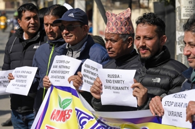 Human rights activists hold placards during a demonstration outside the Russian Embassy in Kathmandu on Feb. 5. Nepali mercenaries are fighting for Russia in Ukraine, lured to kill far from their Himalayan homeland by promises of a passport and cash, but wounded returnees warn anyone tempted to join the war: "Do not come." 