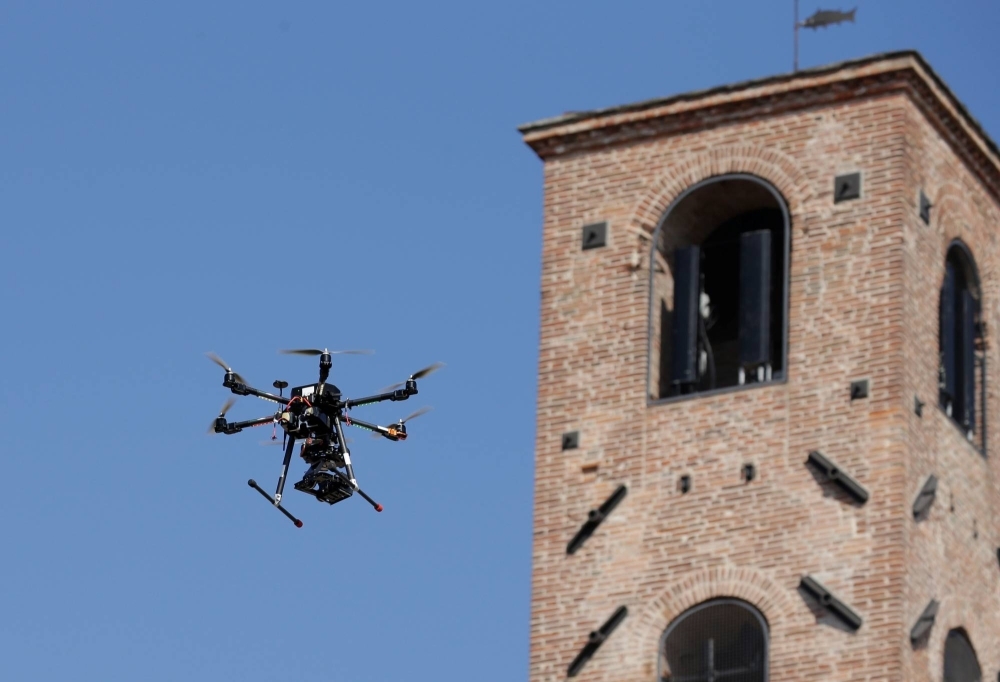 A surveillance drone is seen in midair during the G7 foreign ministers' summit in Lucca, Italy, in 2017. 