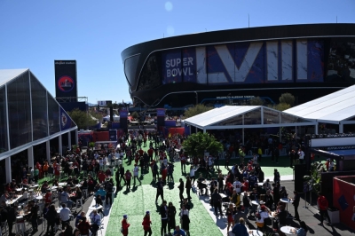 Fans gather outside Allegiant Stadium in Las Vegas before the start of Super Bowl LVIII on Sunday.