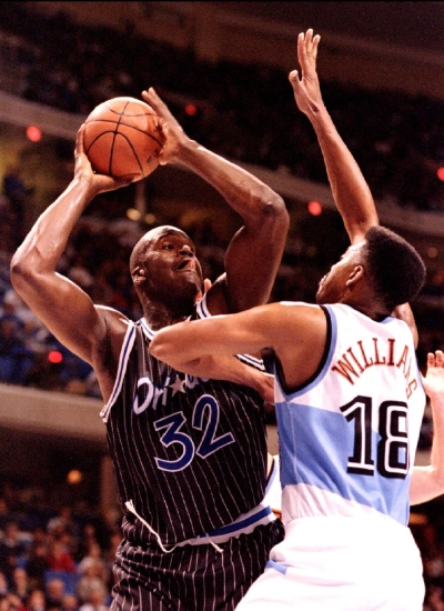 Shaquille O'Neal (left) of the Orlando Magic faces John Williams of the Cleveland Cavaliers in Cleveland, Ohio, in December 1994. Magic are set to retire O'Neal's No. 32 jersey after a game on Tuesday.