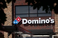 Domino's Pizza Japan has apologized for a video of its employee pretending to pick his nose and wipe it on pizza dough. | Bloomberg