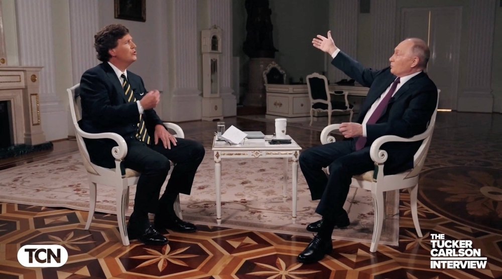 U.S. television host Tucker Carlson interviews Russian President Vladimir Putin in Moscow in on Feb. 6. Carlson was criticized for failing to challenge the Russian leader on much of what he said. 