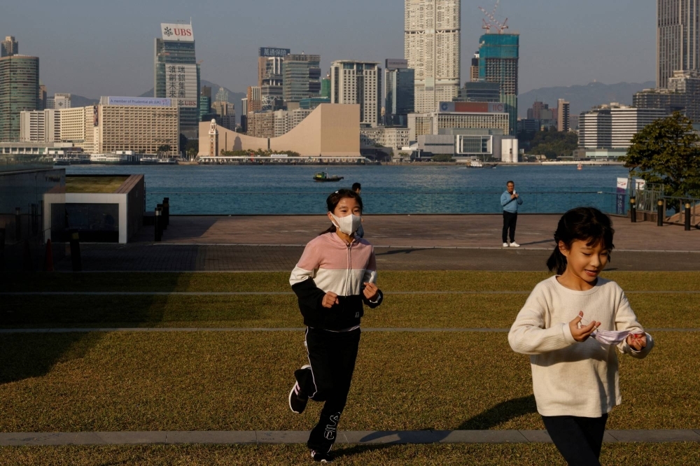 Children play at a park during the COVID-19 pandemic in Hong Kong, in 2022. 