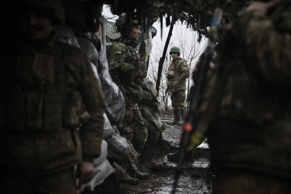 Ukrainian soldiers in a trench in the Donetsk region of Ukraine in January