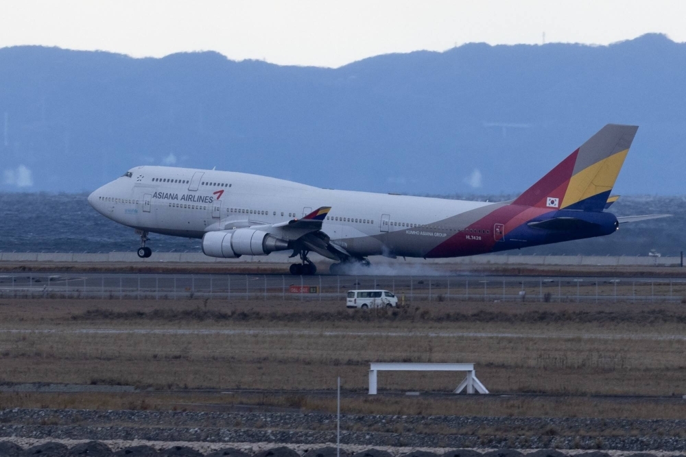An Asiana Airlines passenger aircraft lands at Kansai International Airport in Osaka, Japan, on Dec. 20, 2023. 