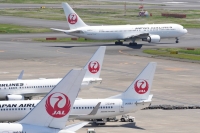A Japan Airlines passenger aircraft at Haneda Airport in Tokyo | Bloomberg
