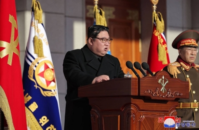 Kim Jong Un gives a speech in Pyongyang on Feb. 8. The North Korean leader has reportedly sent new batches of his workers overseas since relaxing pandemic border controls and launched a fresh crackdown on his people.