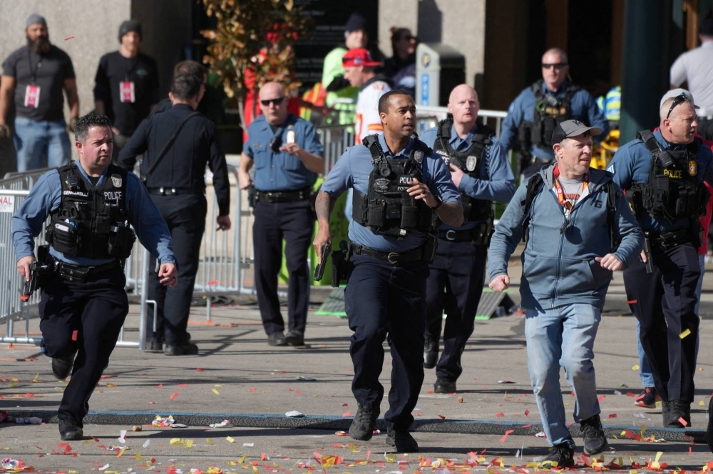 Police respond after shots were fired at the Chiefs' Super Bowl victory celebration in Kansas City, Missouri, on Wednesday.