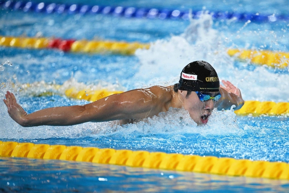 Tomoru Honda competes in the men's 200-meter butterfly final during the swimming world championships in Doha on Wednesday.