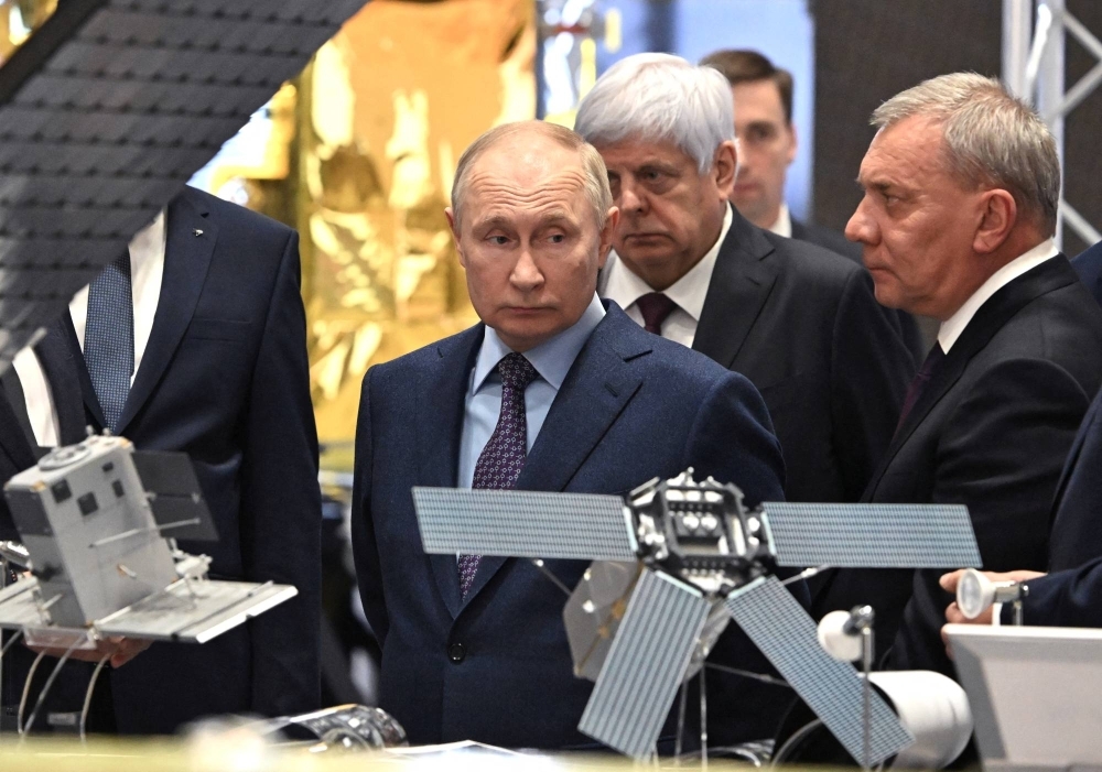 Russian President Vladimir Putin visits an aerospace company in Korolyov, outside Moscow, in October last year. 