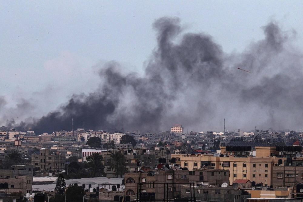 Smoke billows following Israeli bombardment over Khan Younis in the southern Gaza Strip on Thursday.