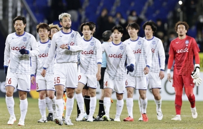 Kofu's players leave the pitch after suffering a 3-0 loss against Ulsan in the first leg of their ACL last-16 clash in Ulsan, South Korea, on Thursday.