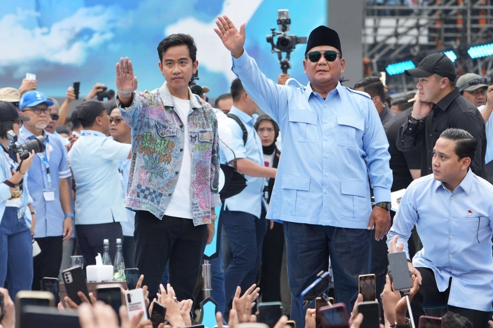 Exit polls show Defense Minister Prabowo Subianto (right) decisively winning the first round of voting for the presidency, eliminating the need for a runoff. The size and scale the election means finalizing the count will take weeks.