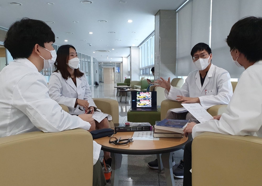 Medical school students discuss striking against the government's medical policies, in Seoul in August 2020. The proposal at the time was shelved after intense opposition.