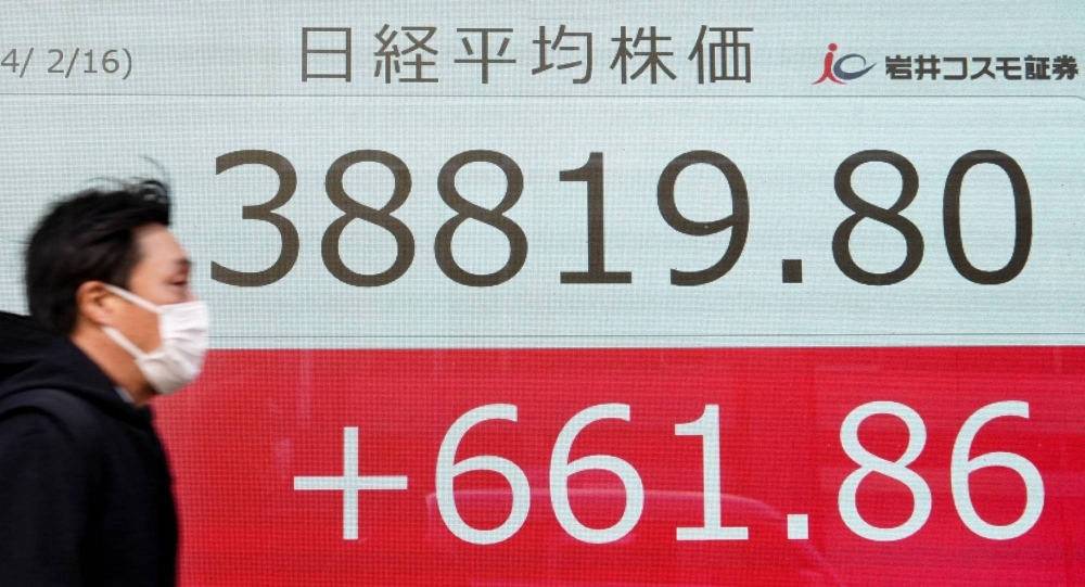An electronic board displays the value of the Tokyo Stock Exchange in Tokyo on Friday.