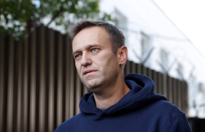 Alexei Navalny speaks with journalists after he was released from a detention center in Moscow in August 2019