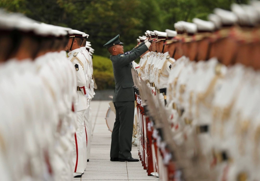 An honor guard from the Self-Defense Forces prepares for a ceremony.
