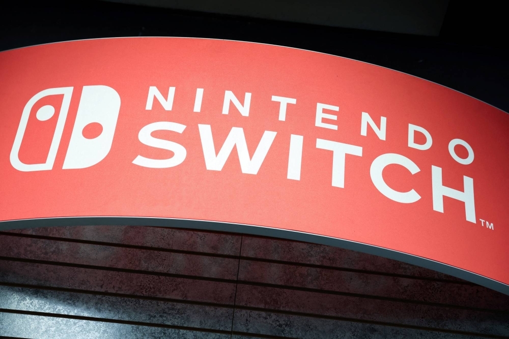 Signage for the Nintendo Switch is seen in Manhattan, New York. The successor to the popular Switch was scheduled for release in late 2024, but several game publishers have been advised of a delay by the company.