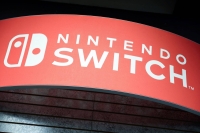 Signage for the Nintendo Switch is seen in Manhattan, New York. The successor to the popular Switch was scheduled for release in late 2024, but several game publishers have been advised of a delay by the company. | REUTERS