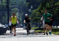 Joggers near the Imperial Palace in Tokyo. Over just one week of a scorching summer the Yomiuri Shimbun daily reported that 935 people were hospitalized for heatstroke and over 500 schools were shut down from Aug. 21 to 27. | Reuters