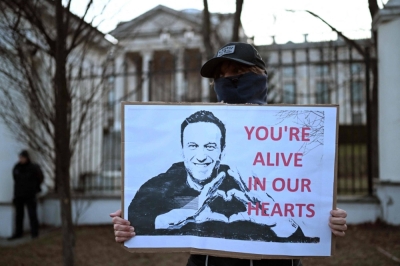 Demonstrators hold a rally to honor the late Russian opposition leader Alexei Navalny in front of the Russian Embassy in Warsaw on Friday. 

 