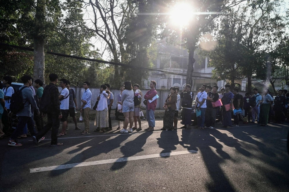 More than 1,000 people lined up at the Thai Embassy in Yangon on Friday after Myanmar's junta said it would soon enforce military service on all men between the ages of 18 and 35 and women between the ages of 18 and 27.