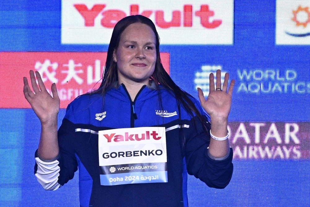 Israel's Anastasia Gorbenko waves on the podium after earning silver in the women's 400-meter individual medey at the 2024 World Aquatics Championships in Doha on Wednesday.